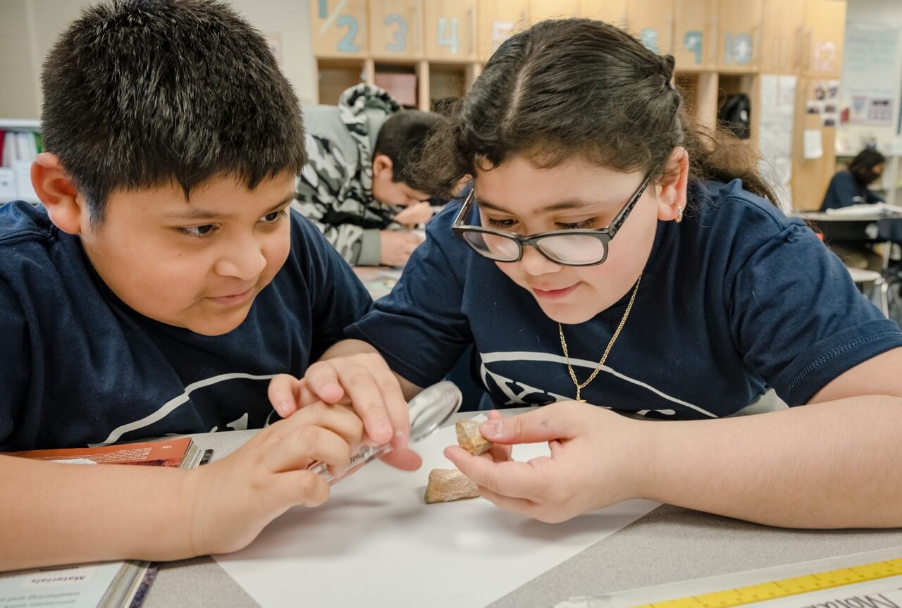 Students looking at rocket
